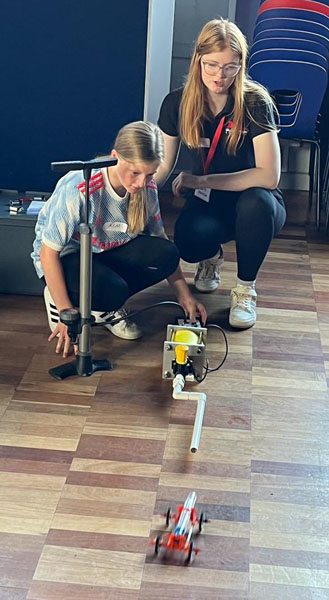 Ambassador with air rocket car student